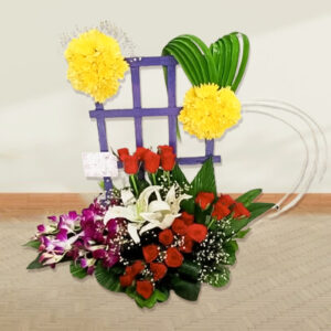 basket of lilies, orchids, roses and daisies