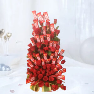 An enchanting arrangement featuring 40 Nestle KitKat Chocolate Wafer Bars (18g each) and 40 Red Roses, adorned with Dressina Green Leaves, presented in a rustic cane basket