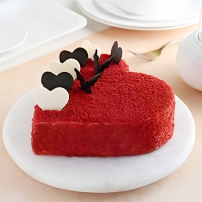 half-kilogram red velvet cream cake, shaped with love in a heart silhouette. This indulgent creation marries the velvety richness of red velvet with the creamy decadence of its exterior.