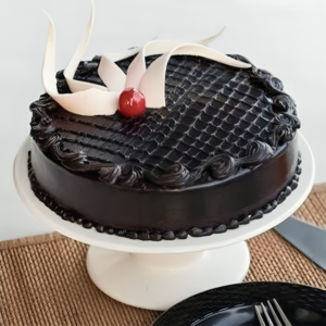 our Dark Chocolate cream cake, available in your choice of half kg, 1 kg, or 2 kg sizes. Crafted to perfection, this round-shaped cake is a luxurious blend of velvety dark chocolate, sure to satisfy even the most discerning chocolate lover's cravings.