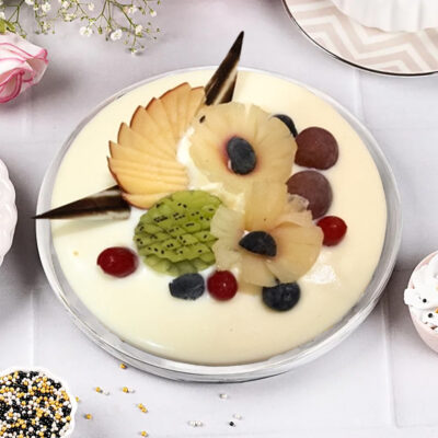Indulge in our Fresh Fruit Cream Cake available in weights of half kg, 1 kg, or 2 kg, and presented in a round shape.