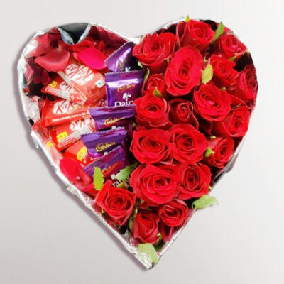 A romantic ensemble of 20 premium quality, unscented red roses elegantly arranged in a heart-shaped box. Accompanied by 5 Dairy Milk chocolates (13.2g each) and 5 Nestle Kit Kat bars (18.7g each).