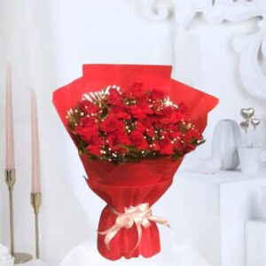 A beautiful bouquet featuring 15 Red Roses accented with delicate White Gypsy Filler, wrapped in red non-woven packing paper, and finished with a white ribbon bow.